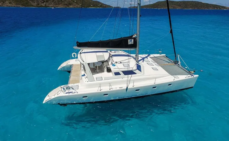 Private 50-foot Voyage 500 catamaran sailing through turquoise Caribbean water on a St. Thomas snorkeling charter